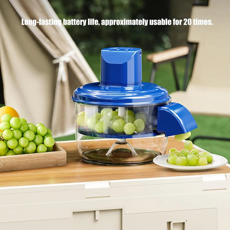 Electric Mini Food Chopper with blue lid chopping green grapes in clear bowl